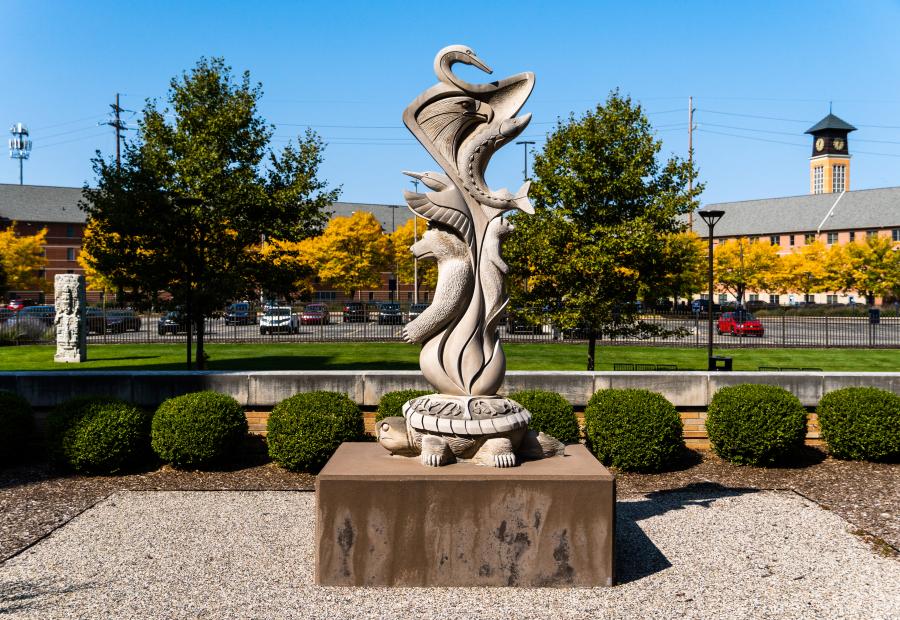 The '7 Chief Clans of the Anishinabe' standing tall at GVSU, symbolizing ArtPrize's contribution to Grand Rapids' cultural fabric.