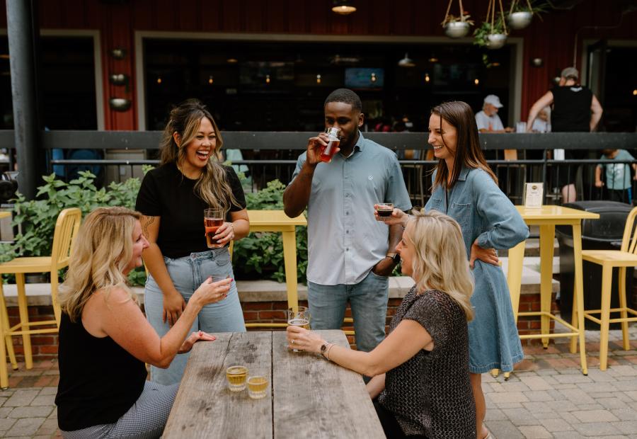 Community and craft converge: Enjoying a flight on Founders' vibrant patio.